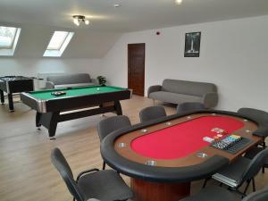 a room with a pool table and ping pong ball at Ízisz Apartman in Mátraterenye