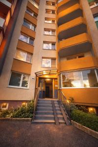 a building with stairs in front of it at Apartman VEMY in Trnava