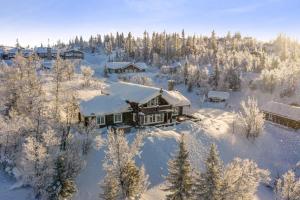 an aerial view of a house covered in snow at Mountain Lodge with Jacuzzi & Views in Aurdal