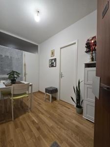 a living room with a table and a dining room at welcome geneva in Geneva