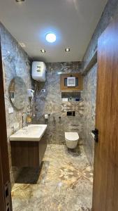 a bathroom with a sink and a toilet at Sheraton Palace Sea View in Alexandria +91 photos