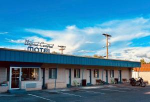 a motel with a sign on the top of it at Grand Central Motel in Ely