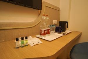 a bottle of water sitting on top of a desk at Hotel Harriet, 50m away from temple Rameshwaram in Rāmeswaram