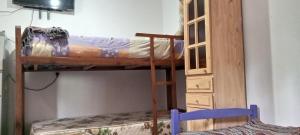 a room with two bunk beds and a cabinet at La Marita in Gualeguay +22 photos