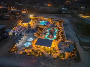 an aerial view of a resort at night at Firefly Lodge - Pool, Theatre, Dog Friendly! in Pigeon Forge