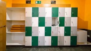 a cabinet with green and white squares on it at Albergue Lecer Sobrado in Porta