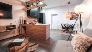 a living room with a couch and a table at FlexHome Gemütliche Ferienwohnung in Lippstadt +16 photos