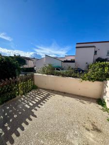 a shadow of a fence and some buildings at Europa Point Area Townhouse in Gibraltar