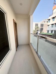 a balcony with a view of a building at Hotel Synergy Stays in Indore