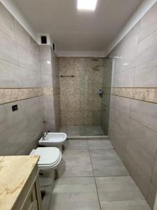 a bathroom with a toilet and a sink and a shower at Casa Susana in Jesús María