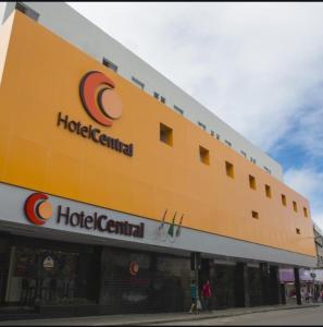 a large yellow building with a hotel central on it at Hotel Central Caruaru in Caruaru
