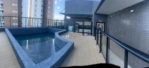 a balcony with a swimming pool on a building at Belize flat praia de Intermares in Cabedelo