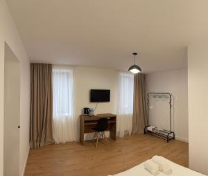 a room with a desk and a computer in it at Amavilla Hotel in Telavi
