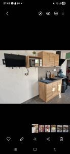 a kitchen with a sink and a counter top at La jonquiere etablisement climatisé in Landouzy-la-Cour