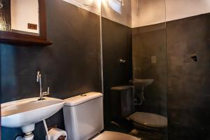 a bathroom with a toilet and a sink at La hospedaria in Trancoso