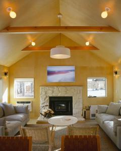 a living room with a couch and a fireplace at Colorado Lodge in Big Bear Lake