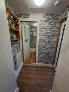 a hallway of a home with a stone wall at Number 2 in Montrose