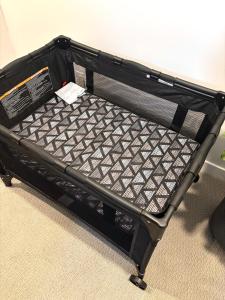 an empty suitcase is sitting on the floor at Cozy Heaven in Saskatoon