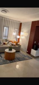 a living room with a couch and a coffee table at D Gomez House in Santiago de los Caballeros