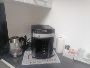 a coffee maker sitting on top of a counter at La tour du bonheur in Mantry