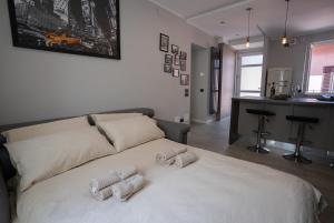 a bedroom with a bed with two towels on it at Centro-Appartamento SanMartino in Varese +22 photos