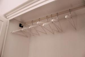 a row of white lights in a room at Dimora Caggione in Polignano a Mare
