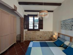 a bedroom with a blue and white bed and a window at Azure Bay Chic Villa in Fontane Bianche +45 photos