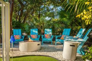 a group of blue chairs and a fire pit at NEW!The HideawayPoolPickleballPutt-PuttKayaks! in Marathon