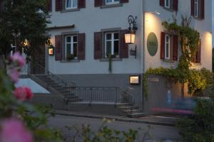 a building with stairs in front of a building at Restaurant Rebea in Sulzburg
