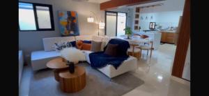 a living room with a couch and a table at Dgomez House in Santiago de los Caballeros