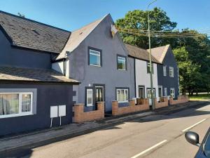 a row of houses on the side of a street at Foxy stays in Tanfield