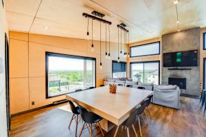 a dining room with a large wooden table and chairs at Jackson 8 - 5 chambres - 18 personnes in Saint-Férréol-les-Neiges