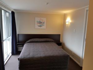 Postel nebo postele na pokoji v ubytování Aspree Motor Inn