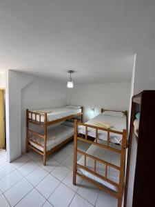 a room with two bunk beds in it at Hospedaje Buen Descanso in Paso de los Libres +12 photos