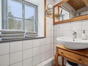 a bathroom with a sink and a window at Kaffeemühle Hamma I in Heringen +23 photos