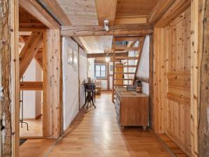 a hallway in a wooden house with wooden beams at Kaffeemühle Hamma II in Heringen