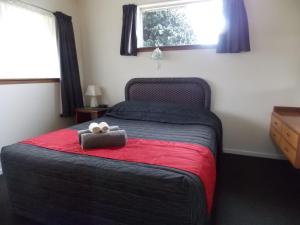 Postel nebo postele na pokoji v ubytování Rangiora Lodge Motel