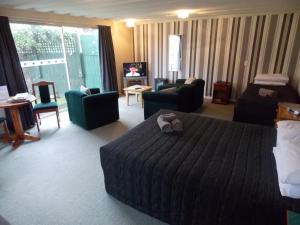 Postel nebo postele na pokoji v ubytování Rangiora Lodge Motel
