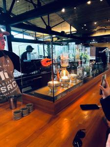 a person taking a picture of a display case in a store at Park View Hotel & Restaurant in Alajuela