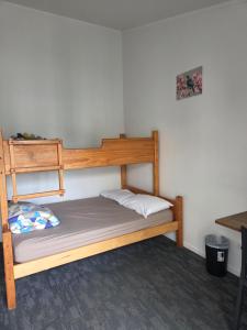 a bedroom with a bunk bed in a room at Tasman Holiday Parks - Coromandel in Coromandel Town