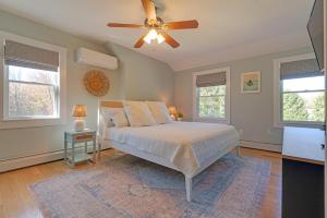 a bedroom with a bed and a ceiling fan at Tidepools Retreat Poolside Family Fun in York +26 photos