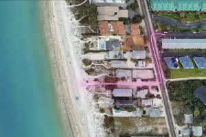 an aerial view of houses next to the water at Oceanview - Steps to Beach - King Suite - Pool - Arcade in Clearwater Beach