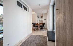 a hallway of a house with a table and chairs at Garden Suite in Binz