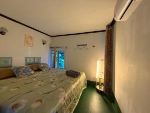 a bedroom with a bed with flowers on it at Baan Plai Laem resort Koh Paluay in Koh Phaluai +147 photos