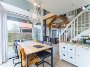 a kitchen and dining room with a table and chairs at Coastal Family Escape with Enclosed Garden in Renesse