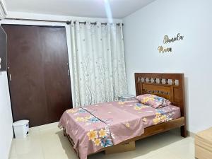 a bedroom with a bed and a sliding door at CASA EN CONDOMINIO d3 MANU in Trinidad