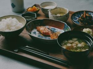 a wooden tray with bowls of food and rice at mont - Nozawa Onsen Ski Resort in Nozawa Onsen +11 photos