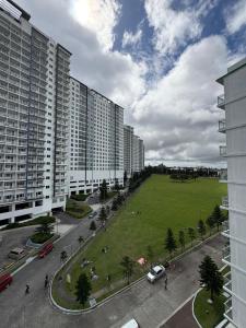 an aerial view of a city with tall buildings at RD Bliss Staycation - SMDC Condo Tower B in Kaybagal