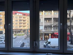 a view of a city street from a window at Capital Gate Guest House in Skopje