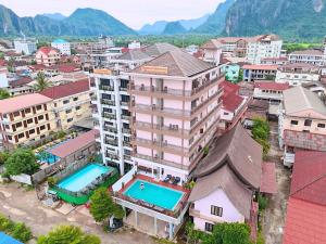 an aerial view of a city with buildings at Vang Vieng Sisavang Hotel in Vang Vieng